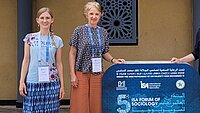 AGICA Team vor dem 5th ISA Forum Schild