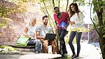 Students are outside with laptops