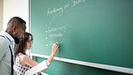 Teaching at a blackboard
